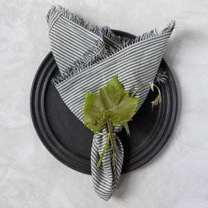 Handwoven fringe edge napkin in black and white stripe by Mulxiply and Campfire Pottery for Ember Maine