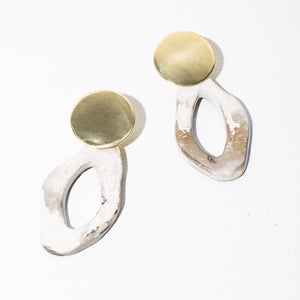 Statement pottery and brass jewelry handmade by fairwage artists.