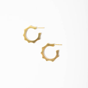 Small and mighty brass hoop earrings with a little edge.