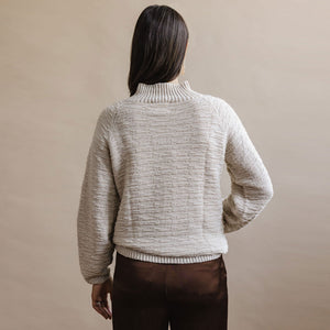 Off-white slouchy sweater for cozy fall style. Sustainably made fashion by Dinadi for Mulxiply.