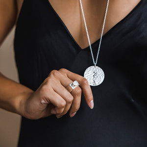 The Moon Coin Pendant Necklace in hammered Sterling Silver.