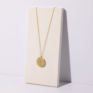 Long coin necklace in brass by Mulxiply