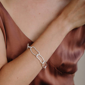 Strong and elegant paper clip chain bracelet in sterling silver.