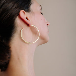 Elegant hoop earrings, made to be remembered.