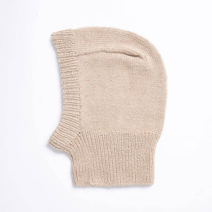 Beige knitted balaclava on a white background