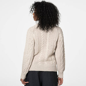 Classic cable-knit sweater in off-white. Ethically handmade in Nepal.