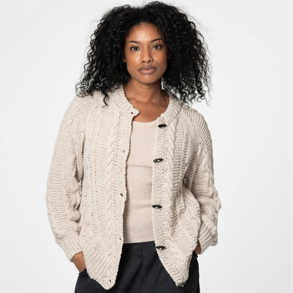 Chunky cable knit cardigan in almond white. Ethically made by Dinadi for Mulxiply.