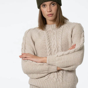 Ethically made cable knit sweater in off white. Made in Nepal.