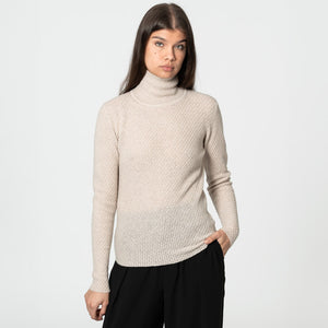Soft merino wool turtleneck made in Nepal.