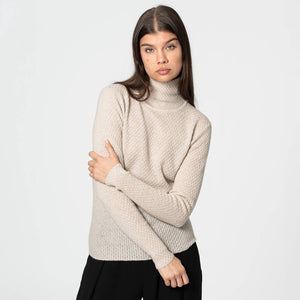 Natural off-white turtleneck sweater in merino wool.