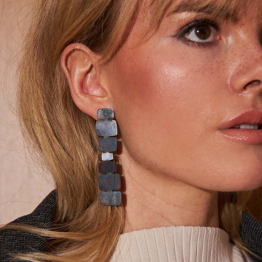 Black statement earrings in oxidized brass by Mulxiply