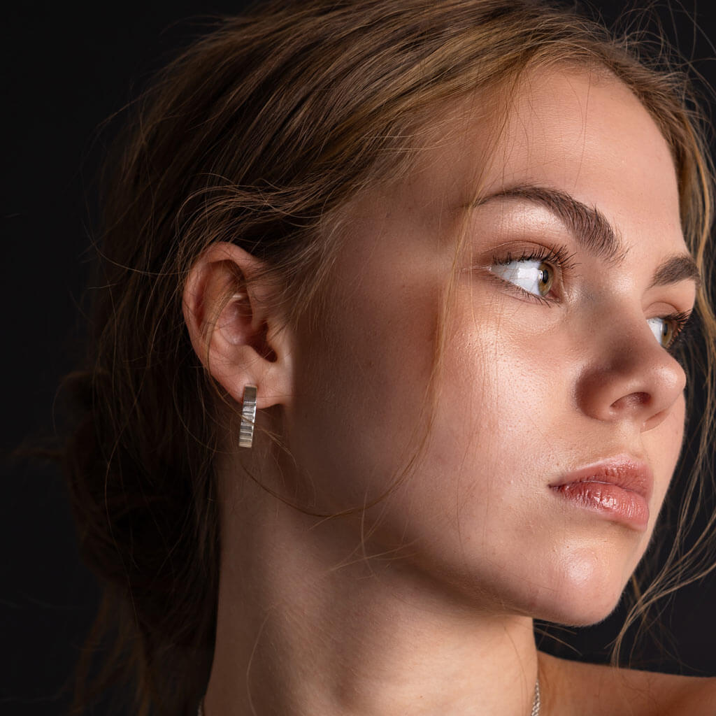 Elegant, arched stick earrings by Mulxiply