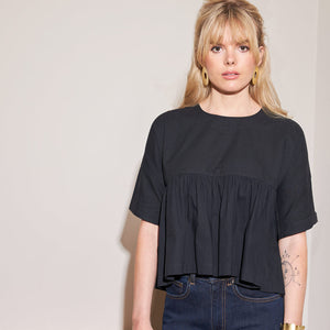 Swingy black short sleeve blouse in black by Mulxiply