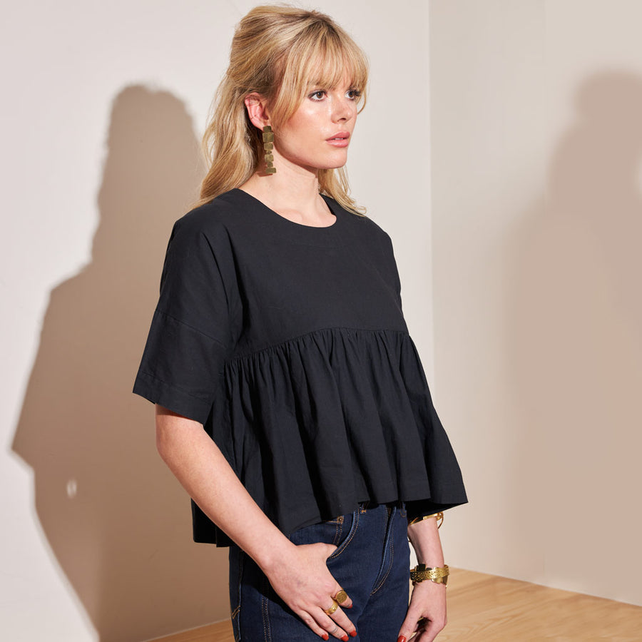 Swingy black short sleeve blouse in black by Mulxiply