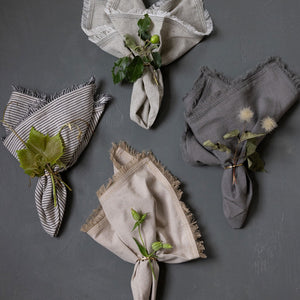 Neutral fringe-edge napkins by Mulxiply and Campfire Pottery for Ember, Maine.