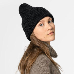 Stylish black beanie hat in soft, no-itch merino wool.