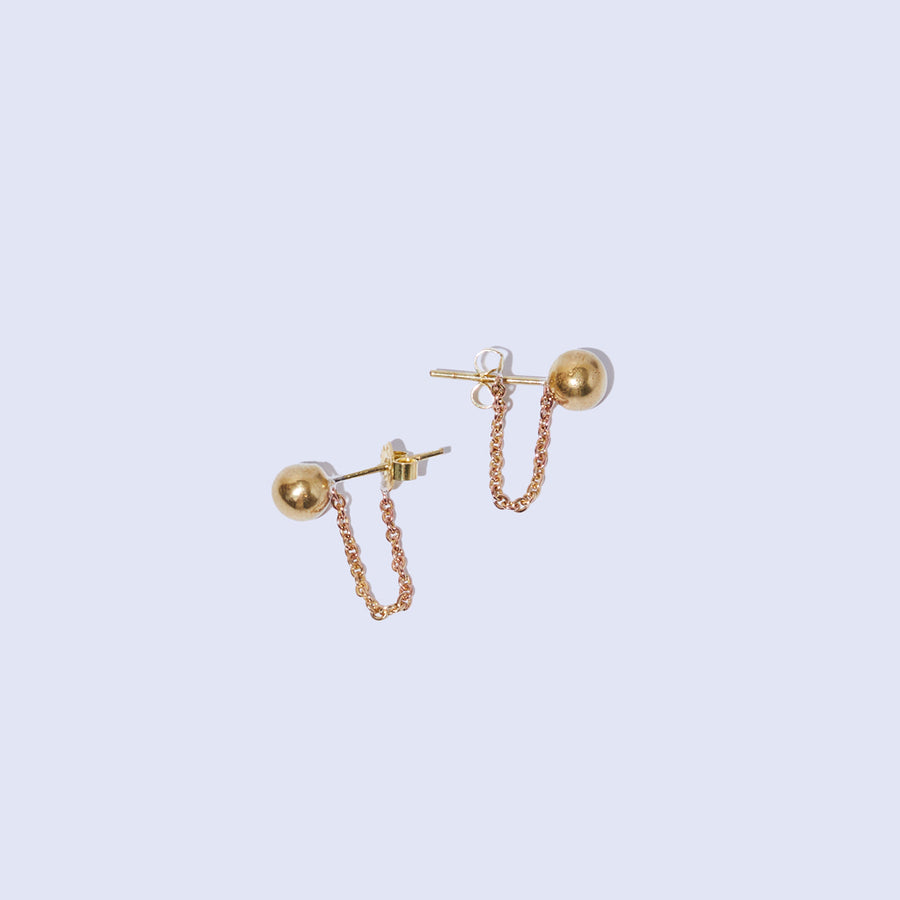Droplet tethered earrings in Brass by Mulxiply