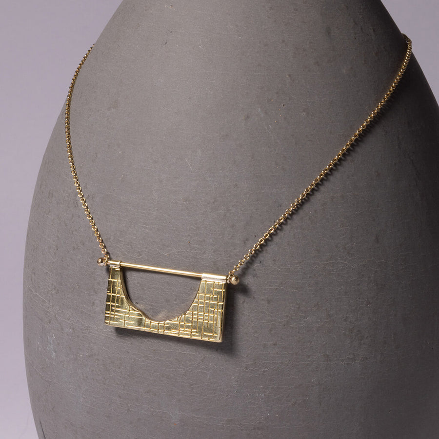 Mid-century modern hatch imprint necklace in Brass by Mulxiply