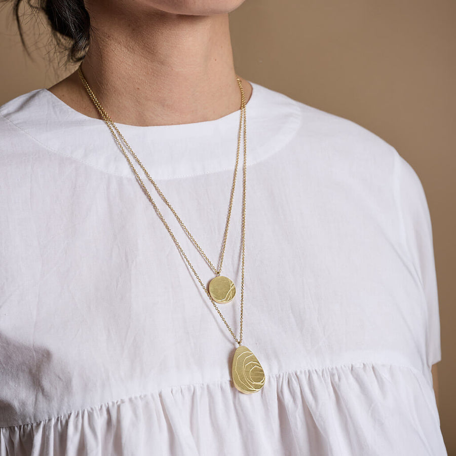 This necklace honors Kintsugi beauty in imperfection. Handmade in Brass.