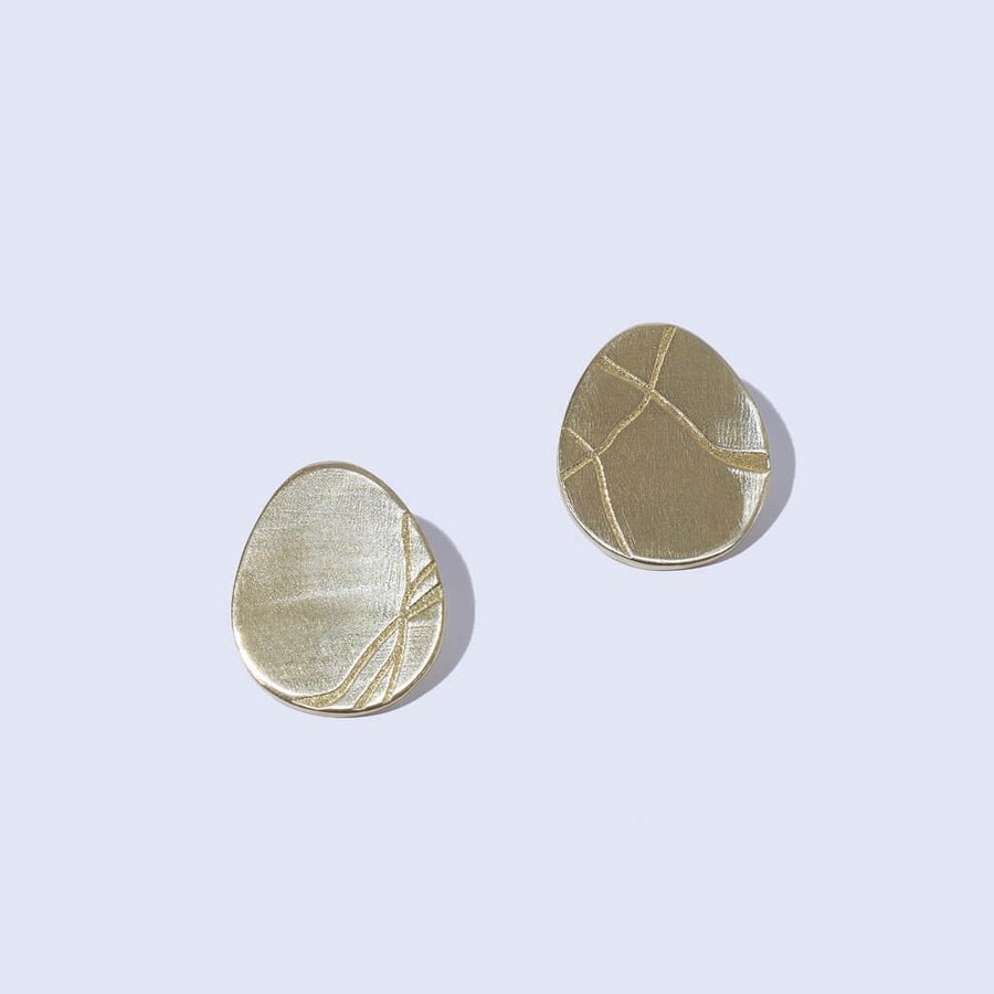 Mismatched everyday earrings with Kintsugi cracks. Ethically handmade by Mulxiply.