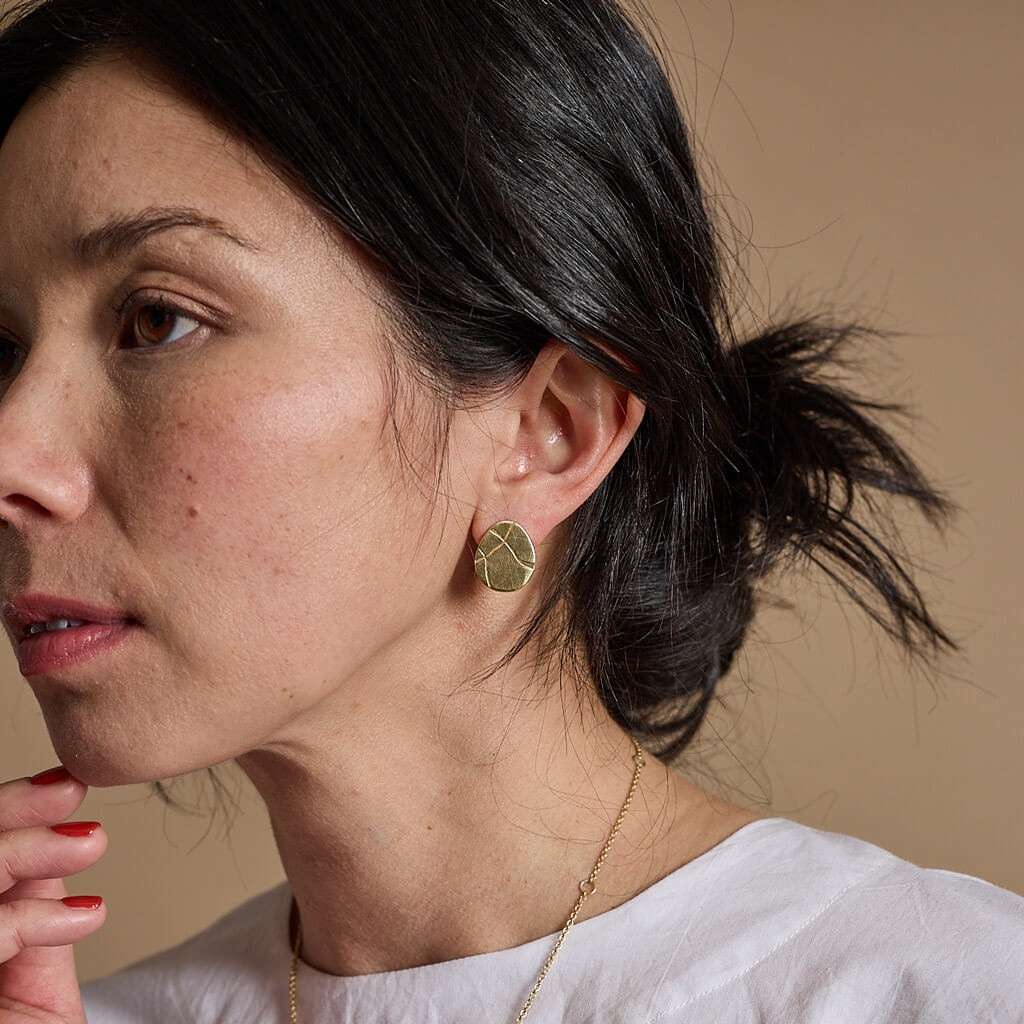 Mismatched everyday earrings with Kintsugi cracks. Ethically handmade by Mulxiply.