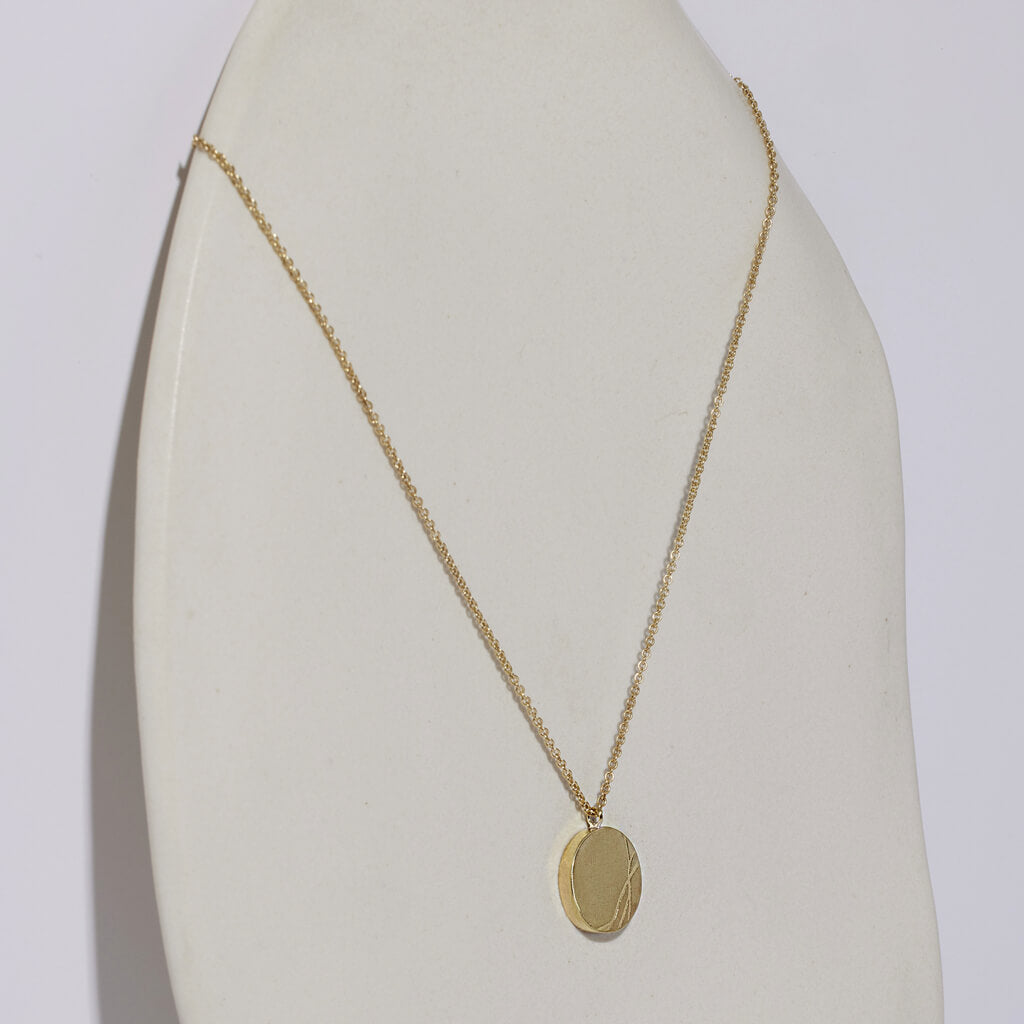 This necklace honors Kintsugi beauty in imperfection. Handmade in Brass.