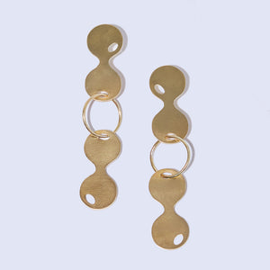 Modern, graphic-shaped, dangle earrings. Crafted by hand.