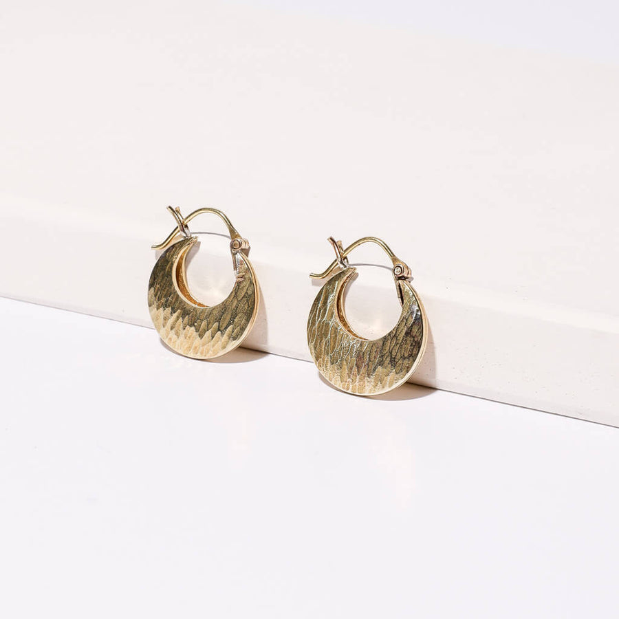 Mini Hoop Earrings by Mulxiply in hammered brass.