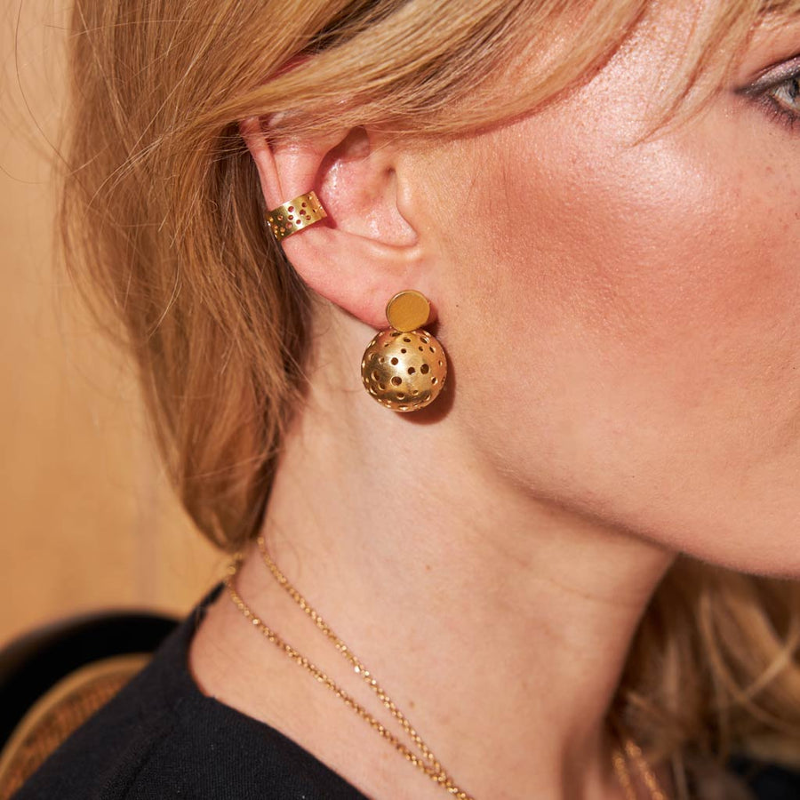 Adjustable ear cuff with holes