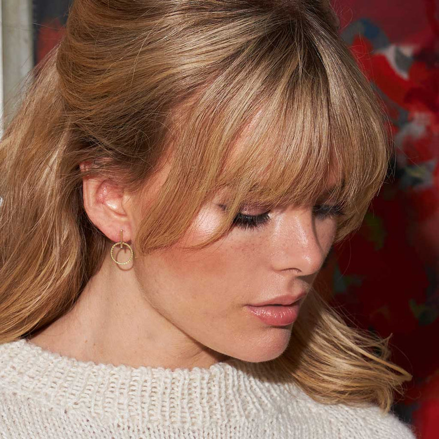 Nautical-inspired earrings in brass by Mulxiply. Maine jewelry.