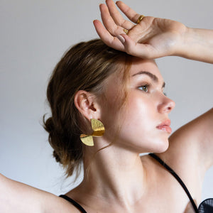 Dance-inspired statement earrings in brass by Mulxiply
