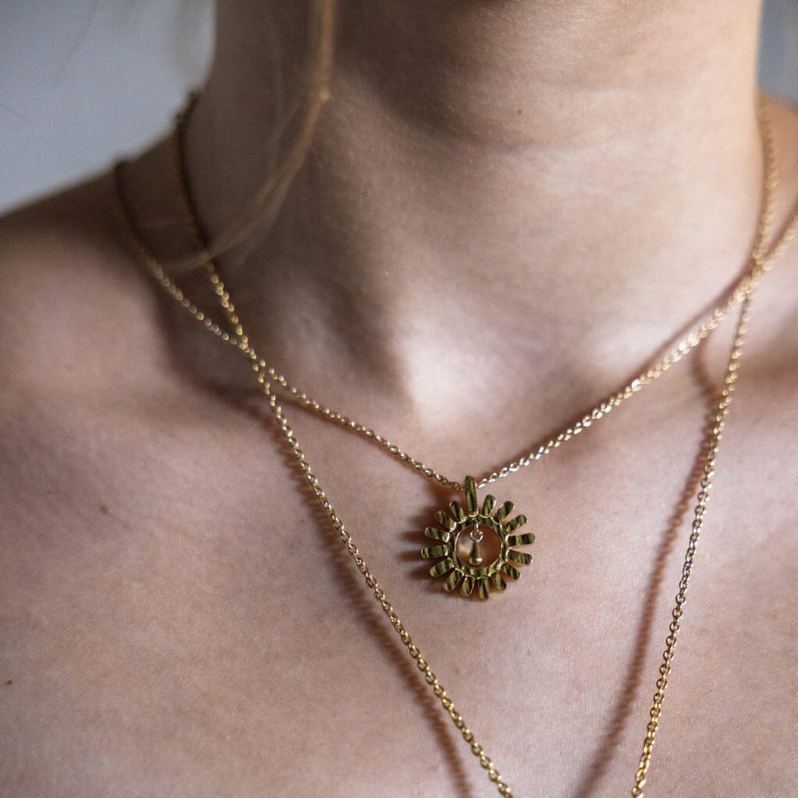 Elegant sunshine charm necklace, ethically crafted in Nepal