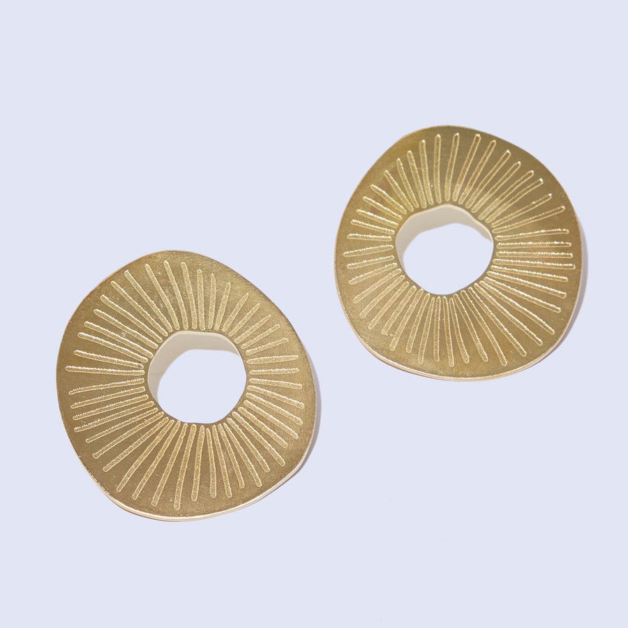 Bold, sun shaped statement earrings by Mulxiply