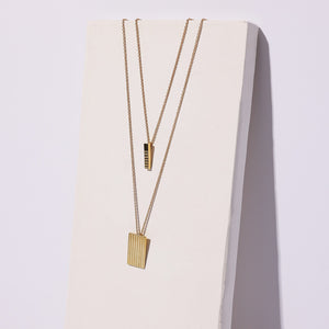 Modern layering necklaces in brass by Mulxiply