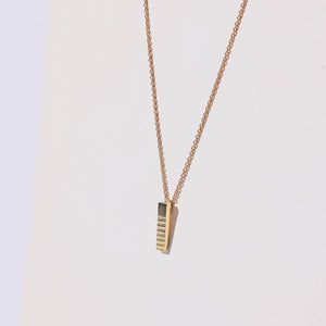 Brass, stick charm necklace. Ethically made in Nepal