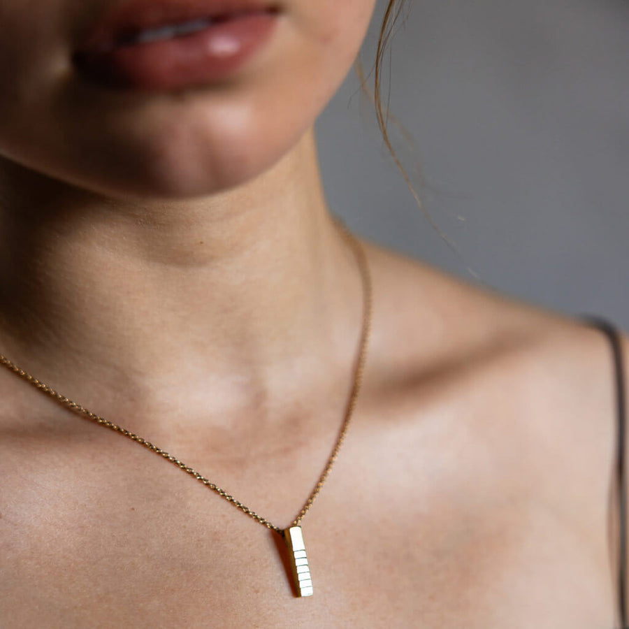 Brass, stick charm necklace. Ethically made in Nepal