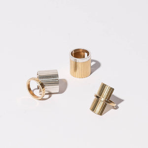 Statement and stacking rings in brass and sterling silver by Mulxiply.