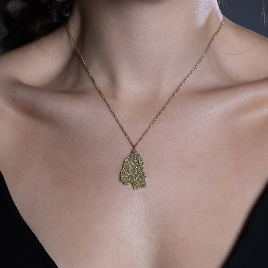 Modern, map-inspired necklace in Brass by Mulxiply