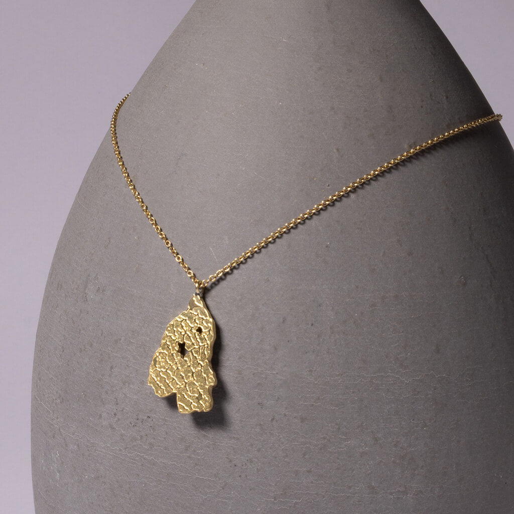 Modern, map-inspired necklace in Brass by Mulxiply