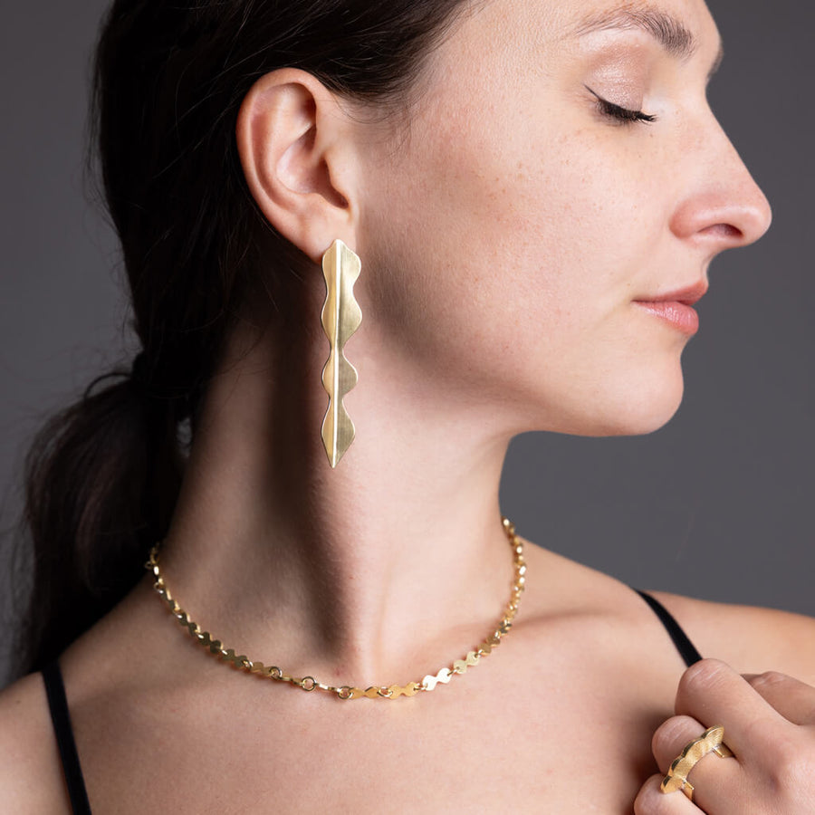 Curvy, dagger shaped brass earrings