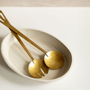Hand-forged brass serving fork and spoon. Designed for Ember Maine by Mulxiply and Campfire Pottery.