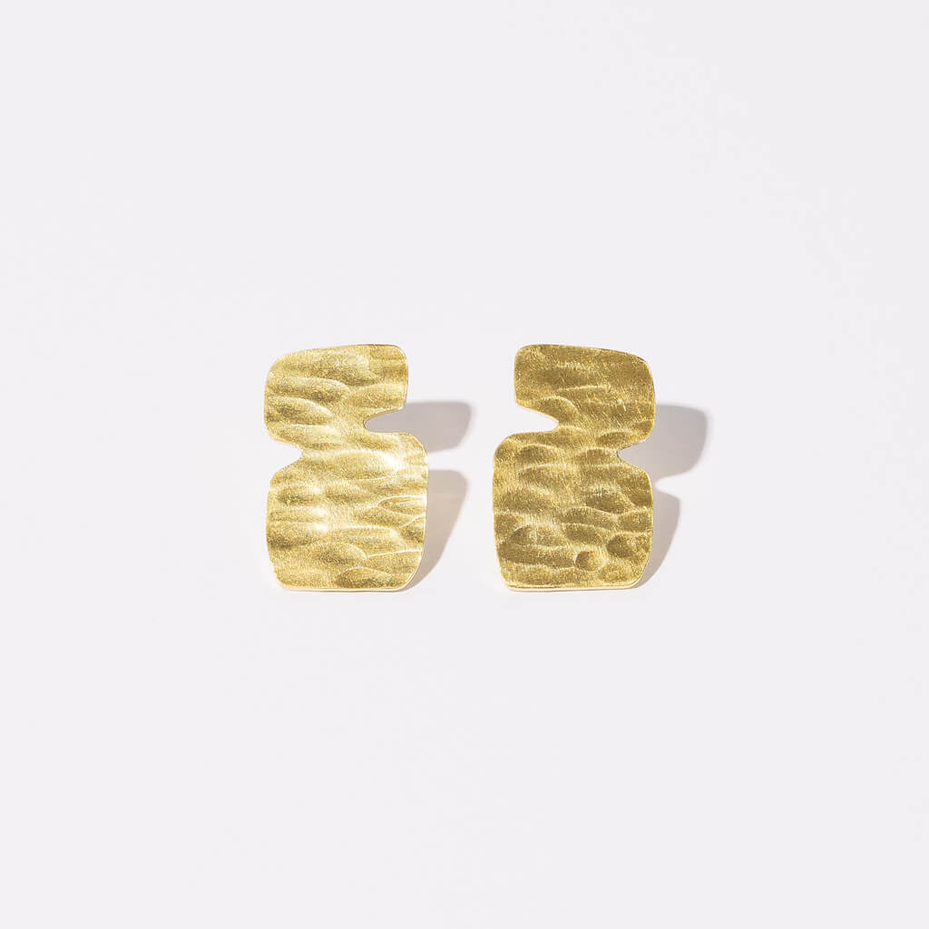 Designed in Maine, made in Nepal, these simple brass earrings are the perfect everyday earring.