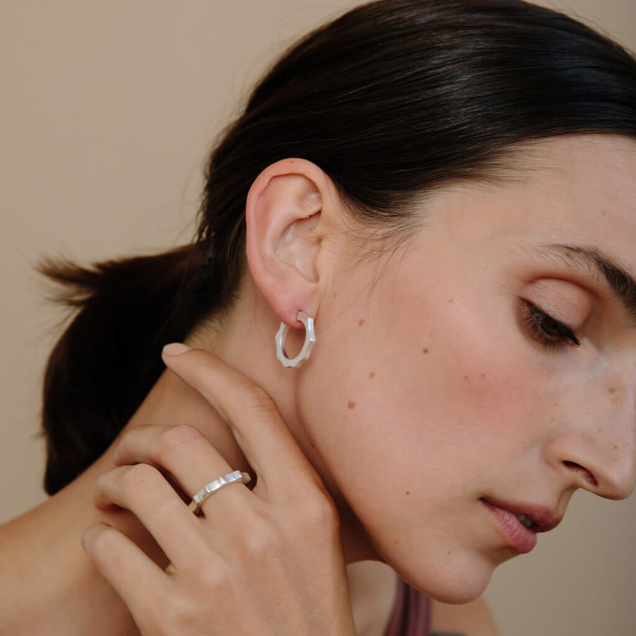 Sterling Silver hoop earrings that are modern with a little edge.