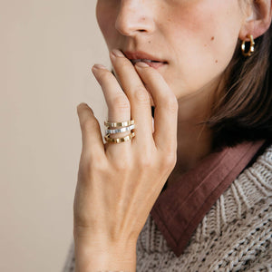 Modern stackable rings in brass and sterling silver. 