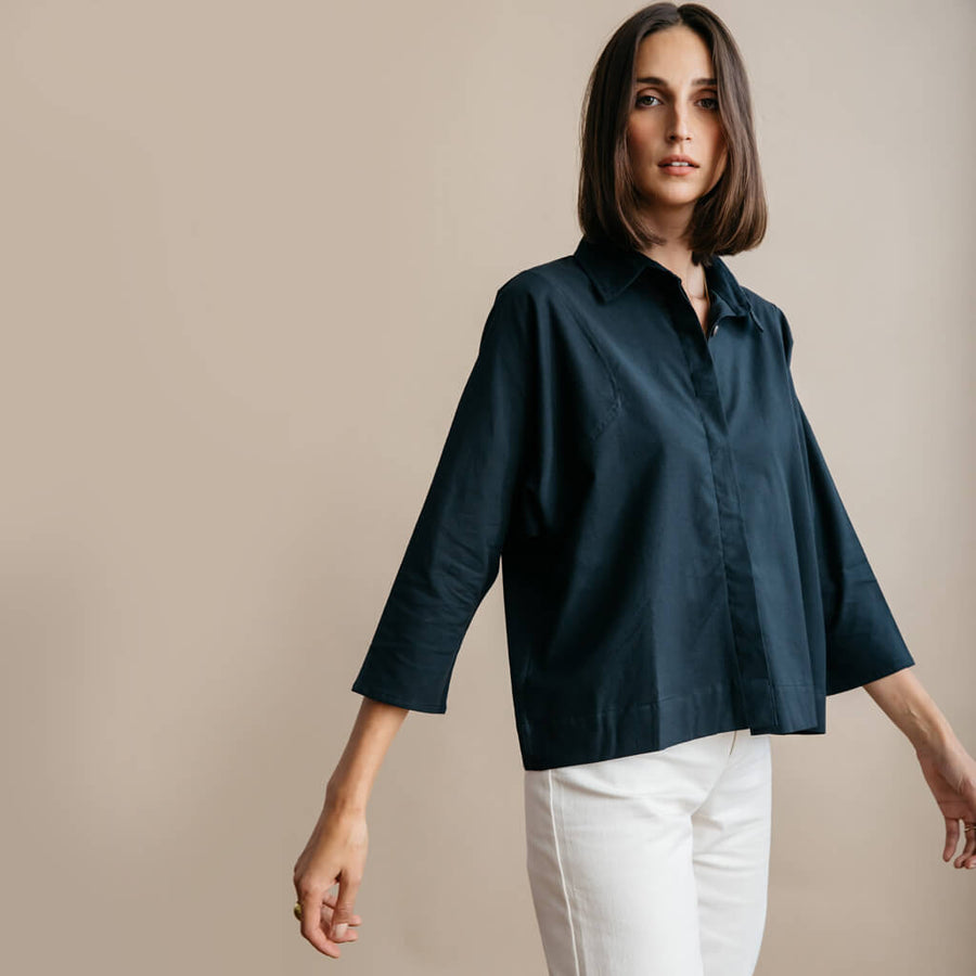 Black button down shirt. Functionally cut to fit comfortably.