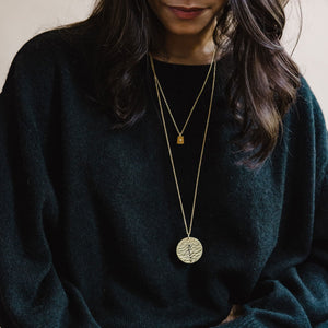 Modern, handmade layering necklaces in brass and sterling silver by Mulxiply.
