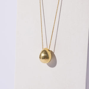 Orb shaped seed pod necklace. Fluid and organic ethically made in Nepal.