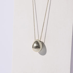 Organic droplet shaped pod necklace. Ethically made in Nepal