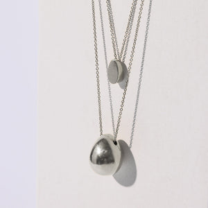 Sterling Silver layering necklaces in modern shapes by Mulxiply.