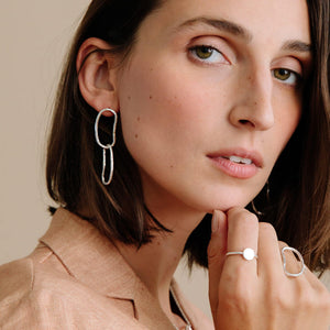 Silver silhouettes dance on your ears and elevate any outfit from day-to-night.